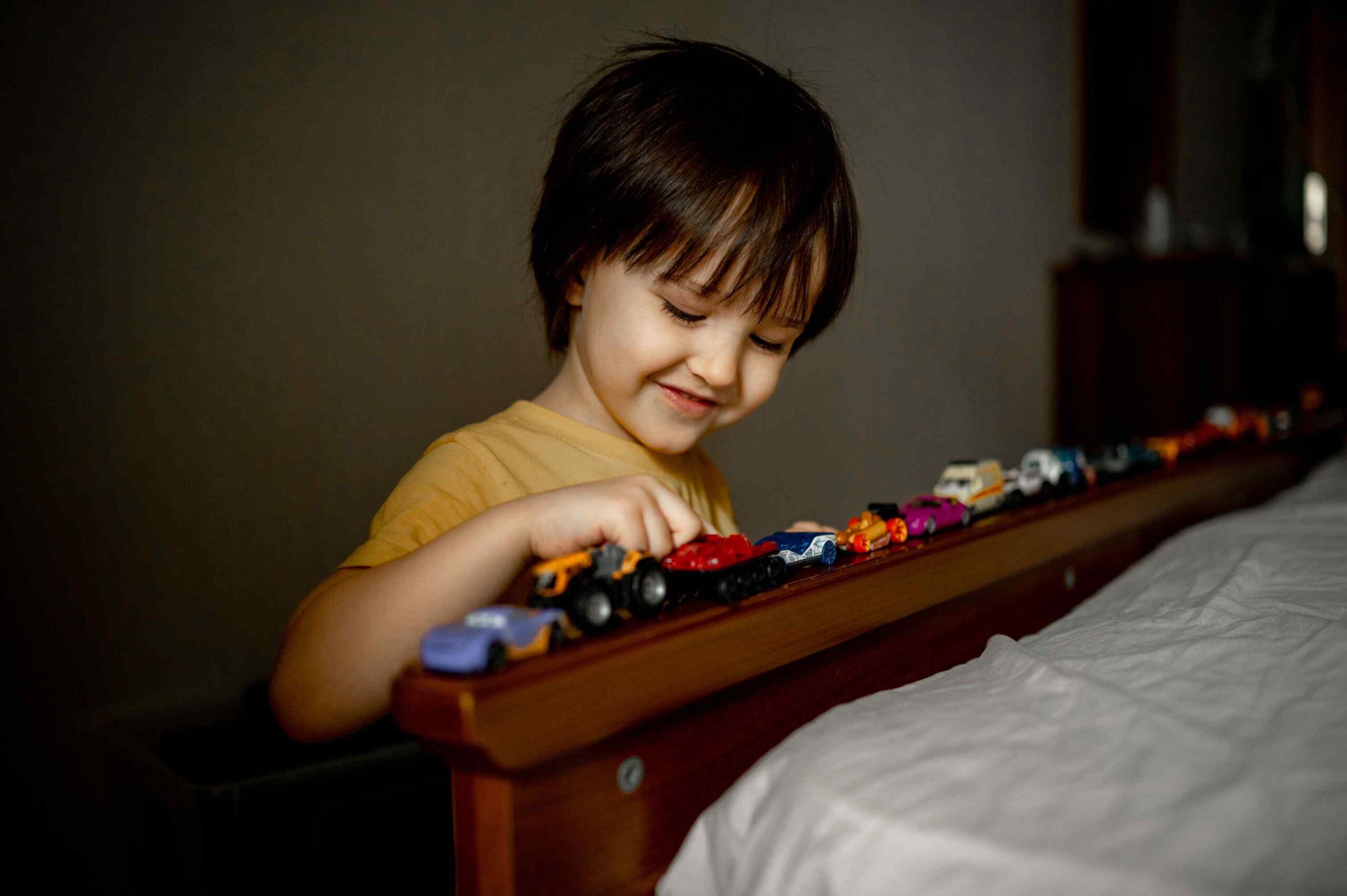 a-boy-at-home-is-playing-with-toy-cars-traffic-ja-2022-11-15-08-05-33-utc